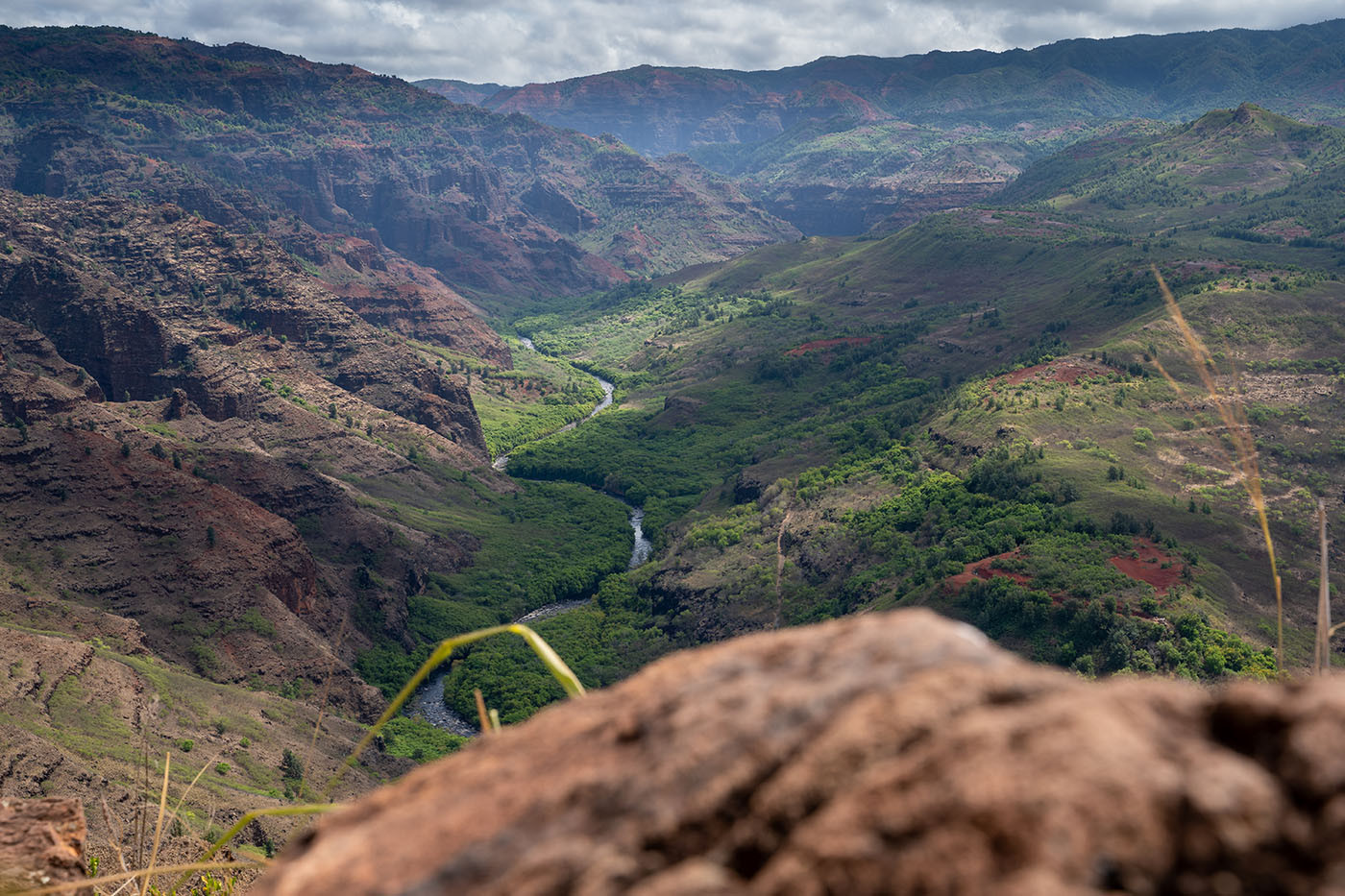 waimea-canyon-kauai.jpg Green river valley winding through the red and brown walls of Waimea Canyon