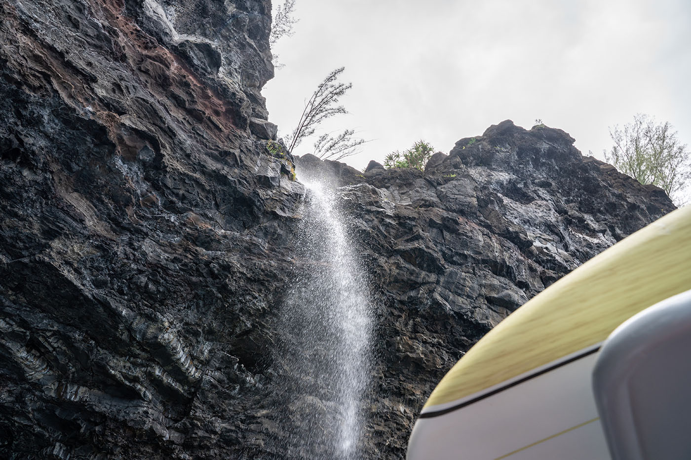 cave-waterfall.jpg Spray falling beside the tour raft at the base of a sea-cliff waterfall