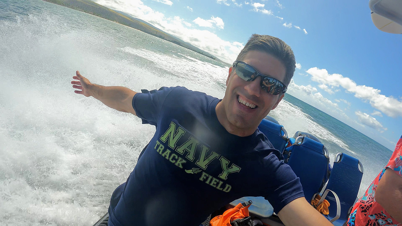 captain-andys-rhib-tour.jpg Passenger smiling as the rigid inflatable boat speeds along the Kauai coast