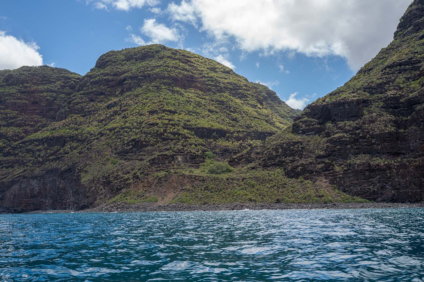 na-pali-coast-kauai.jpg Rounded green ridges rising above the blue water along the Na Pali Coast