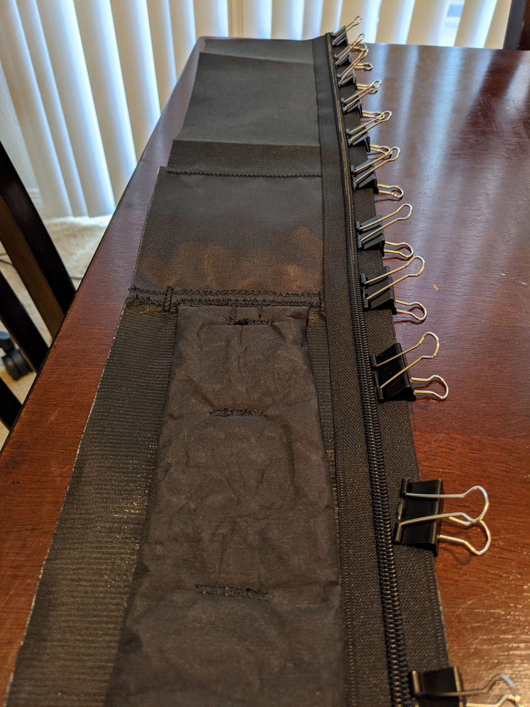 Back-panel zipper clipped in place along the black Dyneema fabric