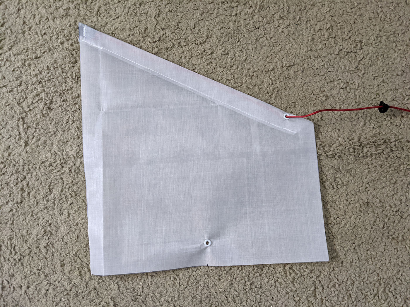 Finished Dyneema side pocket with grommets and red shock cord