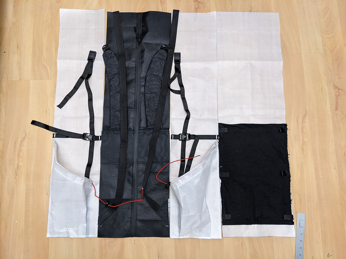 All backpack body panels and the front mesh pocket arranged before final sewing