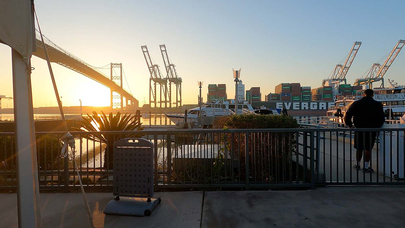 Sunrise over the San Pedro ferry terminal, bridge, and container cranes